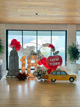 Load image into Gallery viewer, Kayla’s #18 Set up. 4 foamboard cutout: Taxi, Empire State, Apple, plate. Colors: white, silver, red. Delivery: 12/18/2024.